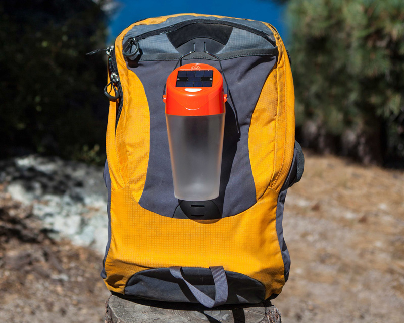 lantern hooked to a backpack